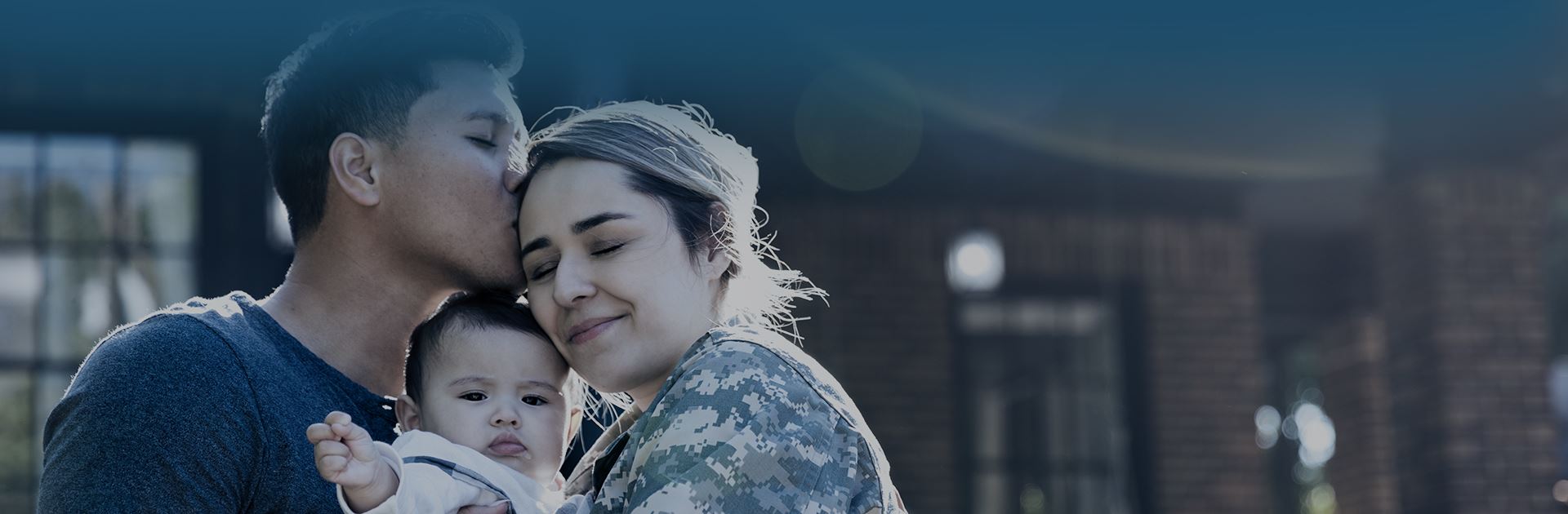 Military family hugging and enjoying each others company