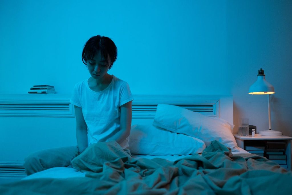 depressed woman on her bed tranquilshores.com